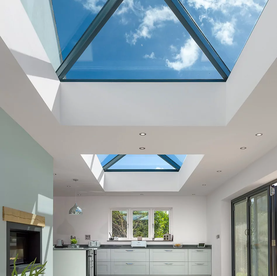 korniche two roof lanterns with blue glass